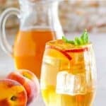 Homemade Olive Garden peach iced tea and fresh peaches.